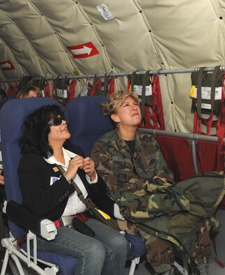 Maj. Howell, 78th Reconnaissance Squadron (right), and Sema Barnes from the Clark County Department of Family Services listen to instructions aboard a KC-135 refueler before taking off for flight. The flight was part of the 926th Group's first Employer Appreciation Day on Apr. 24 recognizing local employers for their support. After the flight the 11 employers enjoyed viewing F-15, F-16, F-22 and A-10 static aircraft on the flightline and a luncheon where they were each presented with an award. (U.S. Air Force photo/Airman 1st Class Brett Clashman)