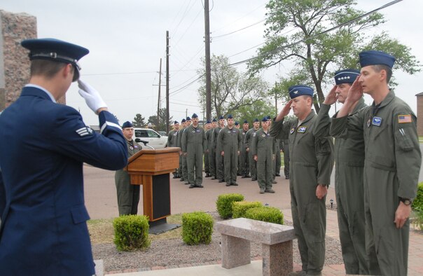 ALTUS AIR FORCE BASE, Okla. – Gen. Stephen R. Lorenz, AETC commander stands with Col. Stuart Shaw, 97 AMW vice commander and Master Sgt. Ernest Burns, Altus Boom Operators Association president as the group render salutes to fallen boom operators at the Boom Memorial April 26. The Boom Memorial honors and gives tribute to boom operators lost in the line of duty. (U.S. Air Force photo/Senior Airman Jennifer L. Flores)