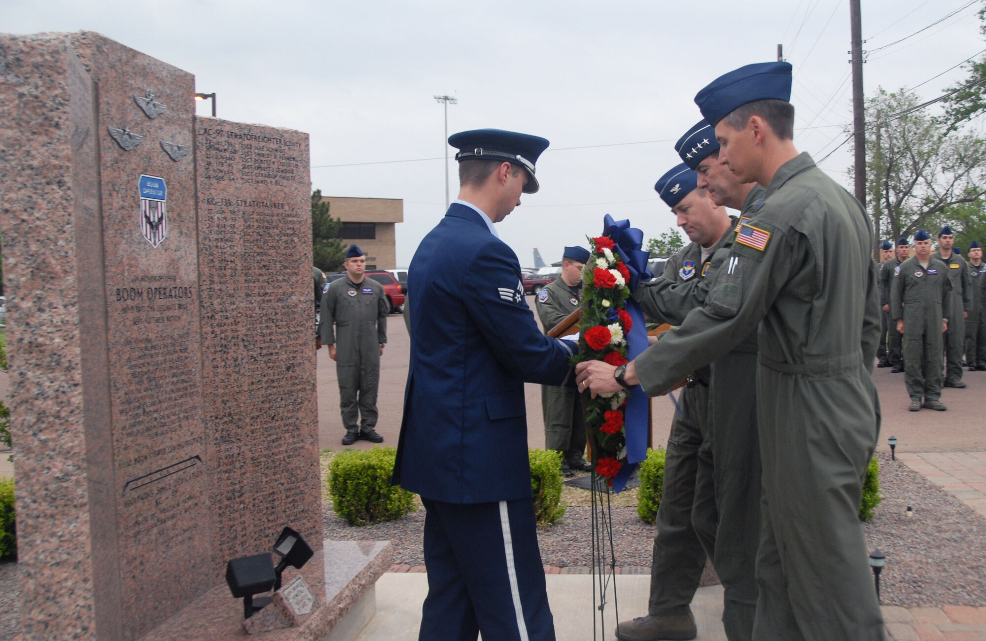 ALTUS AIR FORCE BASE, Okla. – Gen. Stephen R. Lorenz, Air Education and Training Command commander stands between Col. Stuart Shaw, 97th Air Mobility Wing vice commander and Master Sgt. Ernest Burns, Altus Boom Operators Association president. The general placed a wreathe on the Boom Memorial April 26 to conclude the 30th Annual Boom Symposium. The Boom Memorial honors and gives tribute to fallen boom operators.  (U.S. Air Force photo/Senior Airman Jennifer L. Flores)