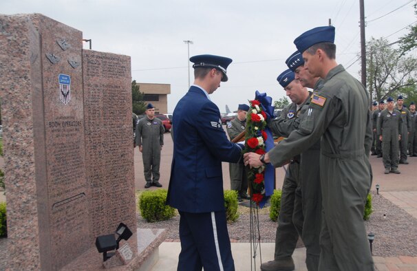 ALTUS AIR FORCE BASE, Okla. – Gen. Stephen R. Lorenz, Air Education and Training Command commander stands between Col. Stuart Shaw, 97th Air Mobility Wing vice commander and Master Sgt. Ernest Burns, Altus Boom Operators Association president. The general placed a wreathe on the Boom Memorial April 26 to conclude the 30th Annual Boom Symposium. The Boom Memorial honors and gives tribute to fallen boom operators.  (U.S. Air Force photo/Senior Airman Jennifer L. Flores)