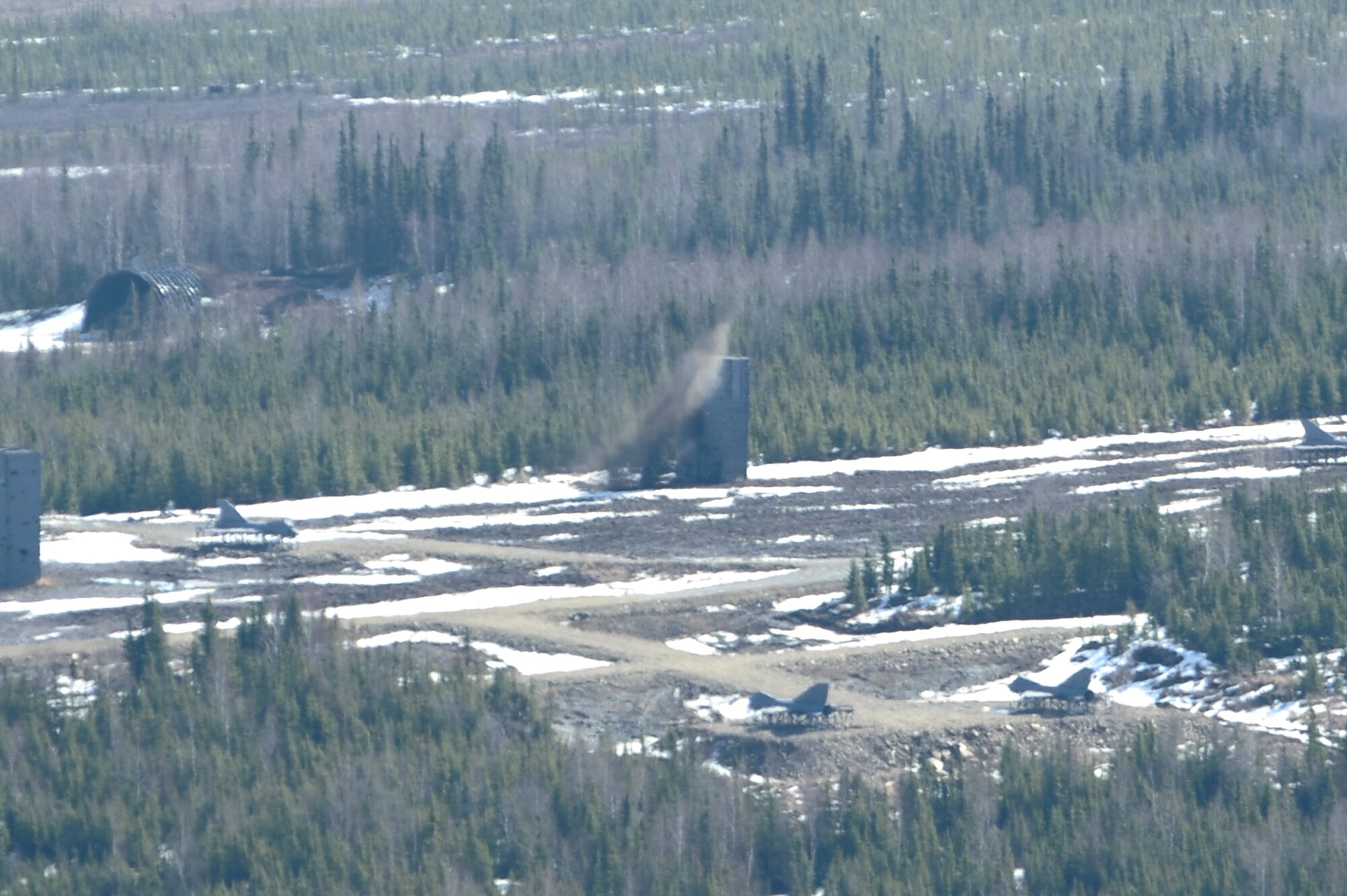 A laser guided bomb hits the target that was designated by 122nd Air Support Operations Squadron members on the Joint Pacific Alaskan Range Complex during RED FLAG-Alaska 09-2 April 28, 2009, Eielson Air Force Base, Alaska. The JPARC provides 67,000 square miles of airspace, one conventional bombing range and two tactical bombing ranges containing more than 400 different types of targets and more than 30 threat simulators.  (U.S. Air Force Photo/Senior Airman Jonathan Snyder)