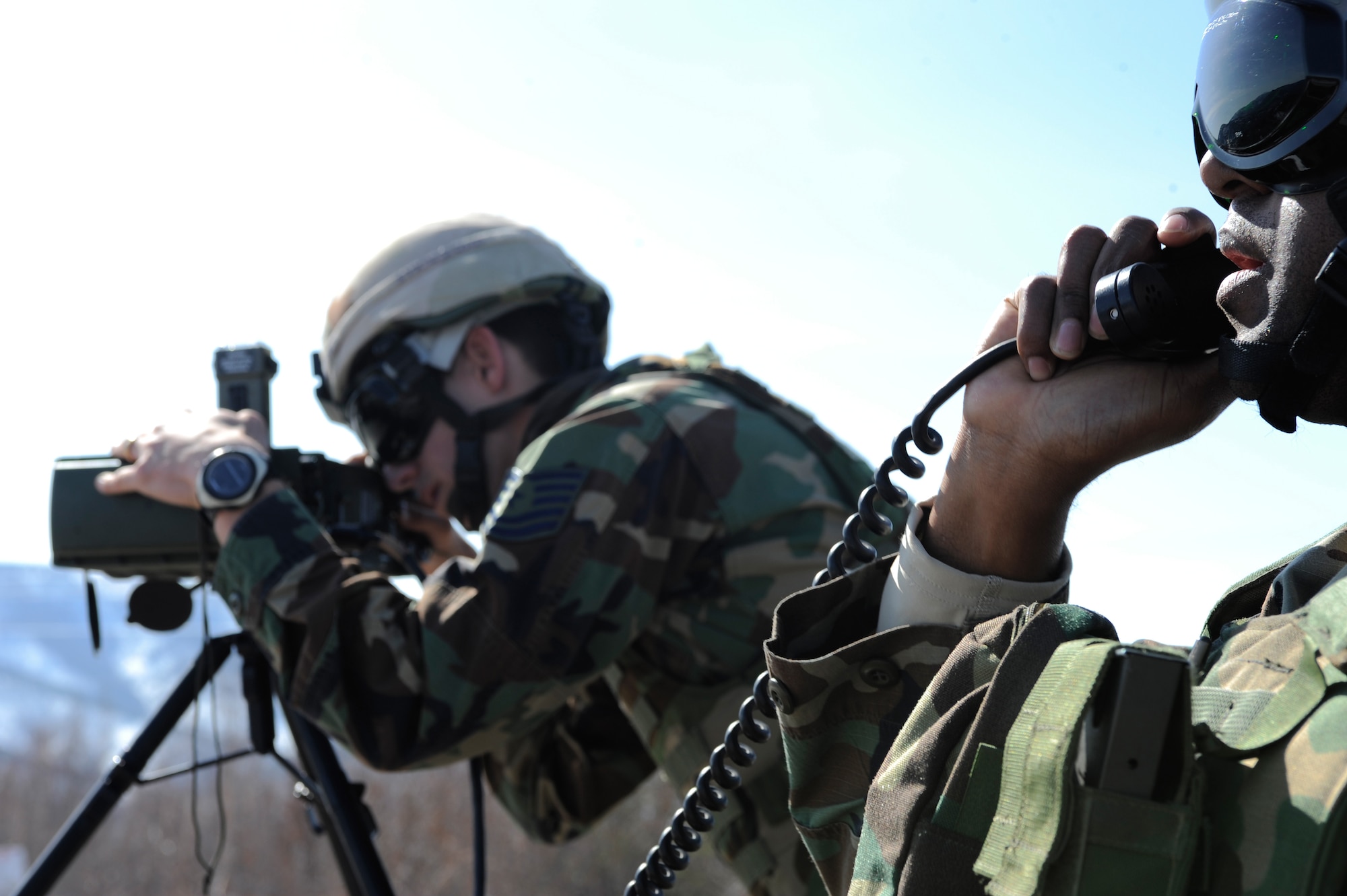 Master Sgt. Allan Floyd communicates directly with the pilot while Tech. Sgt. William Sykes uses a laser target designator to mark a target for the laser guided bomb to hit on the Joint Pacific Alaskan Range Complex during RED FLAG-Alaska 09-2 April 28, 2009, Eielson Air Force Base, Alaska. The 122nd Air Support Operations Squadron coordinates, requests, and controls close air support giving pilots in the air a better visual of a target. Both are assigned to the 122nd ASOS, Louisiana Air National Guard.  (U.S. Air Force Photo/Senior Airman Jonathan Snyder)