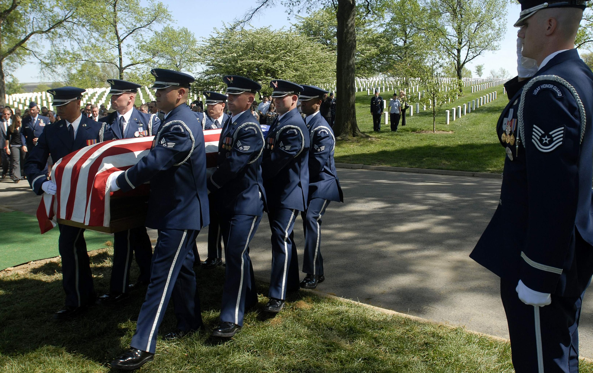 U.S. Air Force Honor Guard Airmen carry the remains of Tech. Sgt. Phillip A. Myers during his funeral April 27 at Arlington National Cemetery. Sergeant Myers, from Hopewell, Va., was killed April 4 in Afghanistan by an improvised explosive device. His family was the first to allow media coverage of the dignified transfer of remains at Dover Air Force Base, Del., since Defense Secretary Robert Gates lifted the 1991 ban April 6. (U.S. Air Force photo/Master Sgt. Stan Parker)