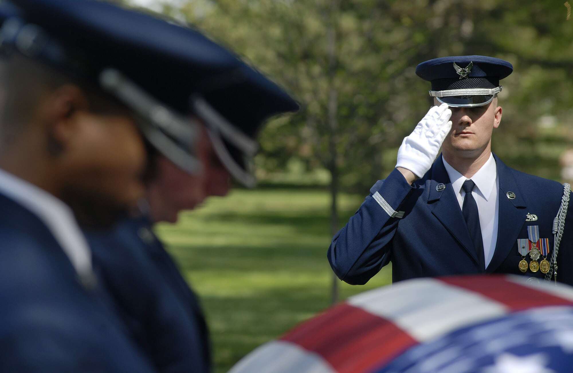 Tech. Sgt. Joseph Matulewicz, U.S. Air Force Honor Guard, renders a salute during the funeral for Tech. Sgt. Phillip A. Myers April 27 at Arlington National Cemetery.  Sergeant Myers, from Hopewell, Va., was killed April 4 in Afghanistan by an improvised explosive device. His family was the first to allow media coverage of the dignified transfer of remains at Dover Air Force Base, Del., since Defense Secretary Robert Gates lifted the 1991 ban April 6. (U.S. Air Force photo/Master Sgt. Stan Parker)