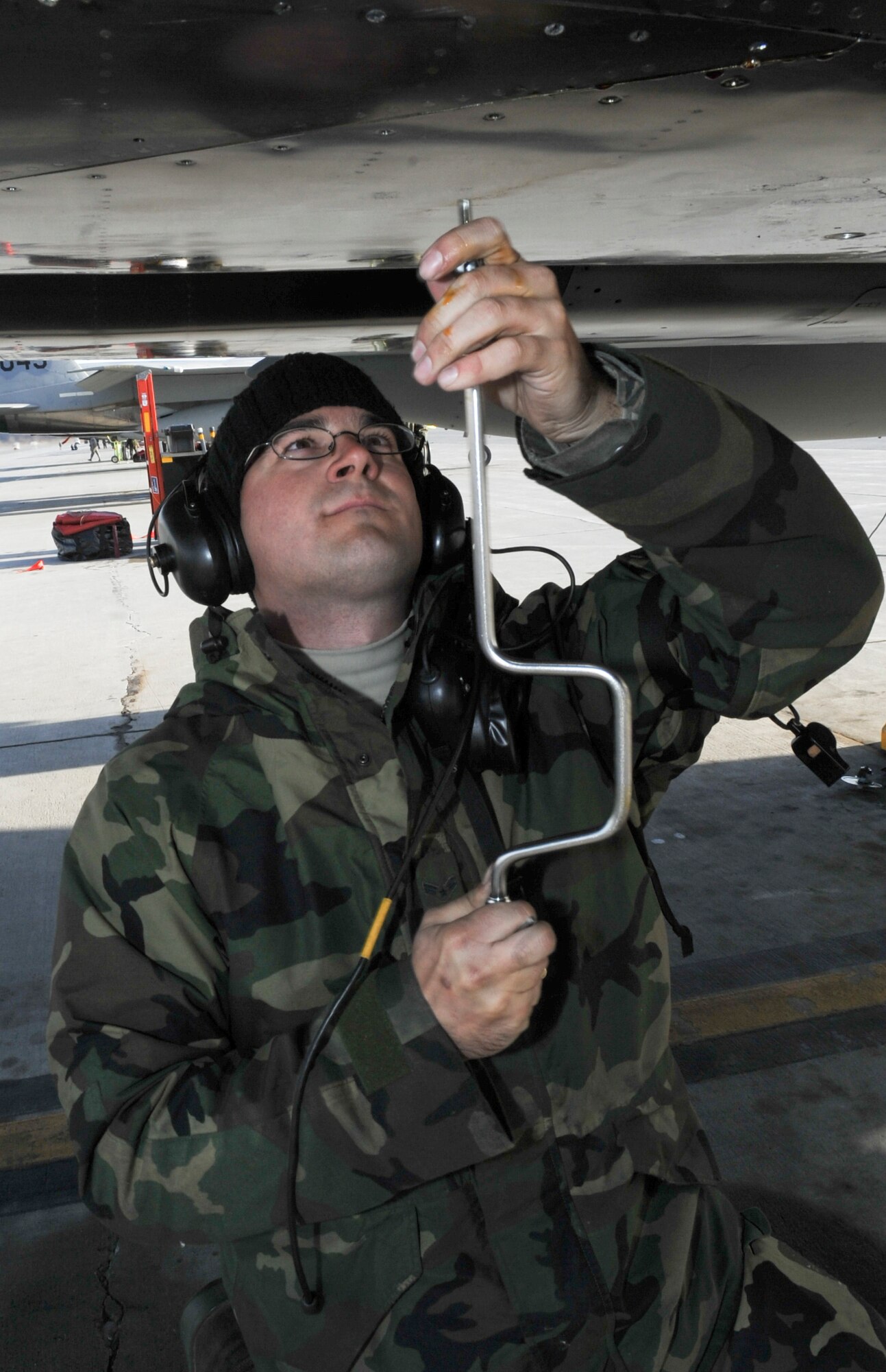 ELMENDORF AIR FORCE BASE, Alaska -- Airman 1st Class Gabriel Doeering ,2nd Aircraft Maintenece Unit, Tyndall Air Force Base, secures a loose rivet on an F-15 Eagle prior to its flight during RED FLAG-Alaska, April 28, 2009. This exercise enables flying squadrons to enhance their fighting capabilities by flying simulated combat sorties in a realistic threat environment.(U.S. Air Force photo by Senior Airman Mathew Owens)