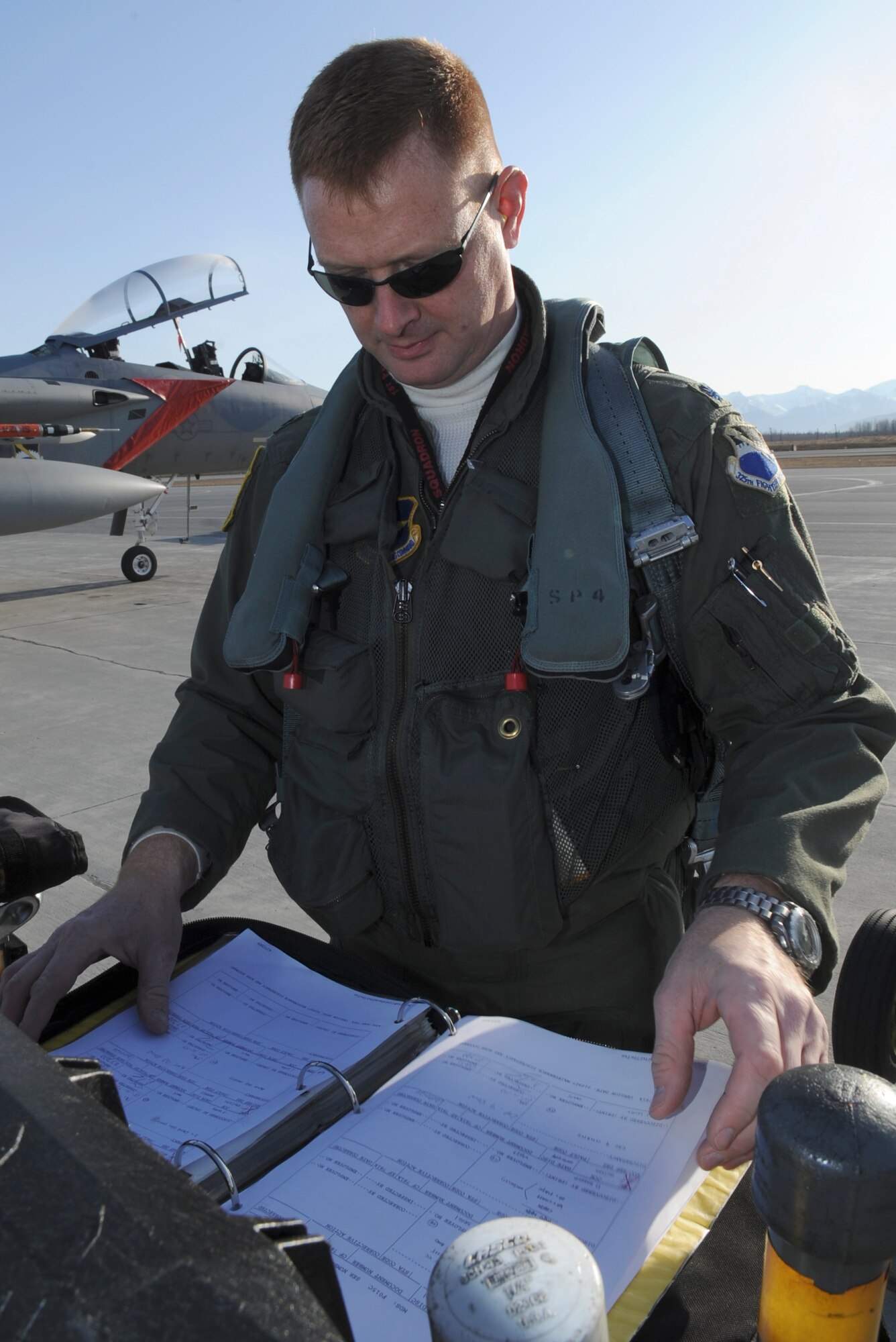 ELMENDORF AIR FORCE BASE, Alaska -- Lt Col Brad Bird,2nd Fighter Squadron, Tyndall Air Force Base, goes over preflight take off procedure prior to  taking off during RED FLAG-Alaska, April 28, 2009. This exercise enables flying squadrons to enhance their fighting capabilities by flying simulated combat sorties in a realistic threat environment.(U.S. Air Force photo by Senior Airman Mathew Owens)
