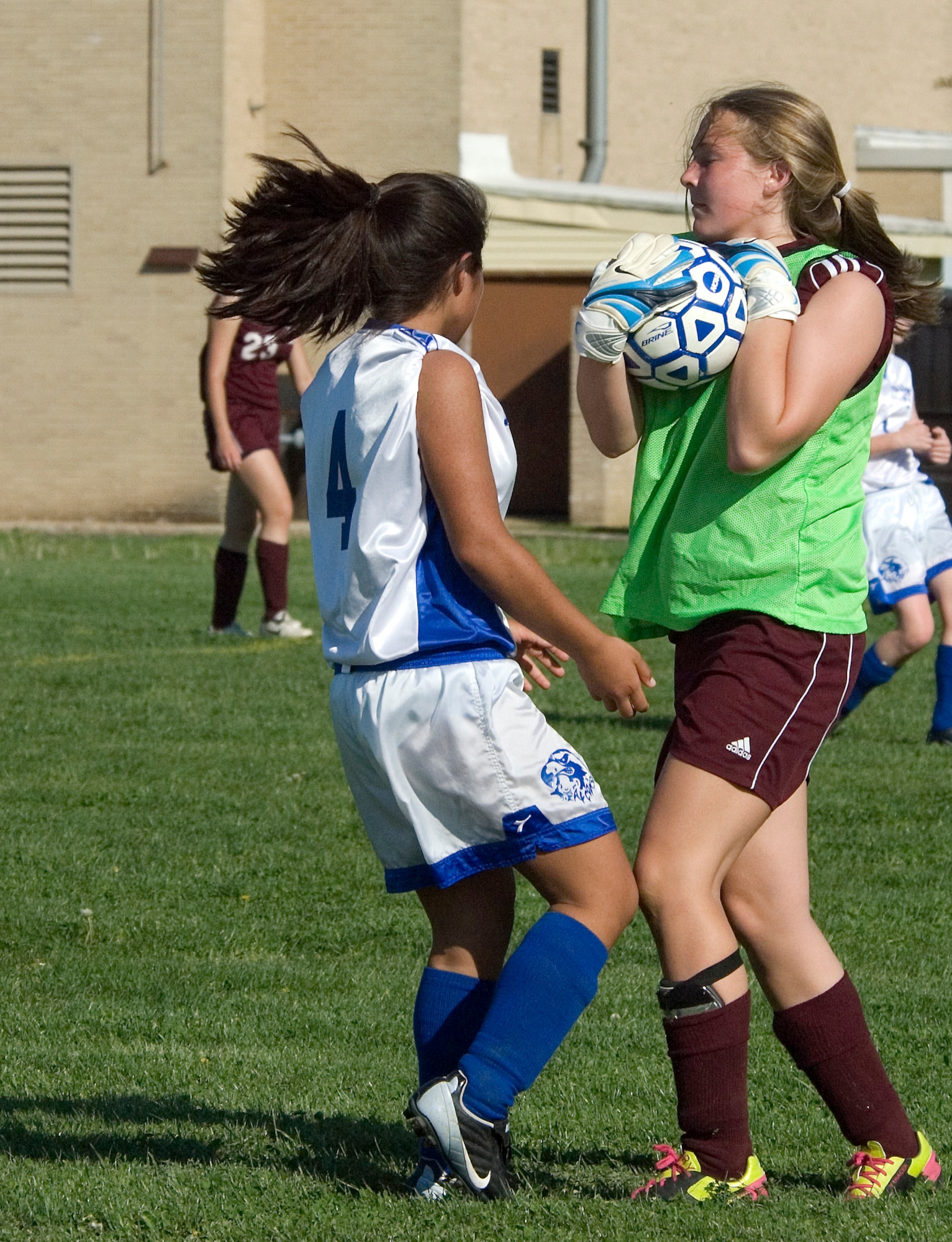 Darlene Bugado, Air Base Middle School Falcon forward, follows through on a goal attempt she made against Milford Middle School Buccaneer goal keeper, Bekah Yanacek, during a game played at Dover Air Force Base April 27. The Falcon?s couldn?t penetrate the Buccaneer defense during the game and the Falcon?s lost 5 ? 0. (U.S. Air Force photo/Tech. Sgt. Kevin Wallace)