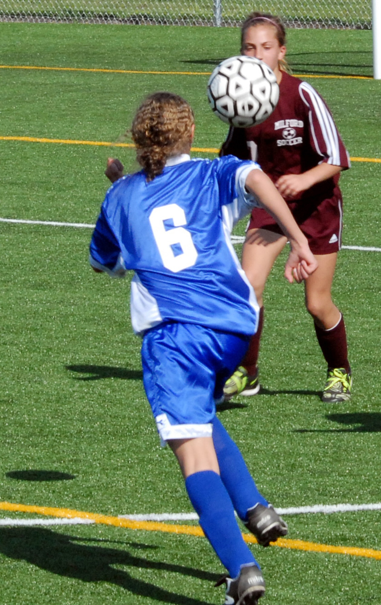 Kassandra Lightburn (front), Air Base Middle School Falcon girl?s soccer player, challenges a Milford Middle School Buccaneer to the ball during a game played at Milford High School April 24. The Buccaneers beat the Falcons 1 ? 0 in the game. (U.S. Air Force photo/Tech. Sgt. Kevin Wallace)