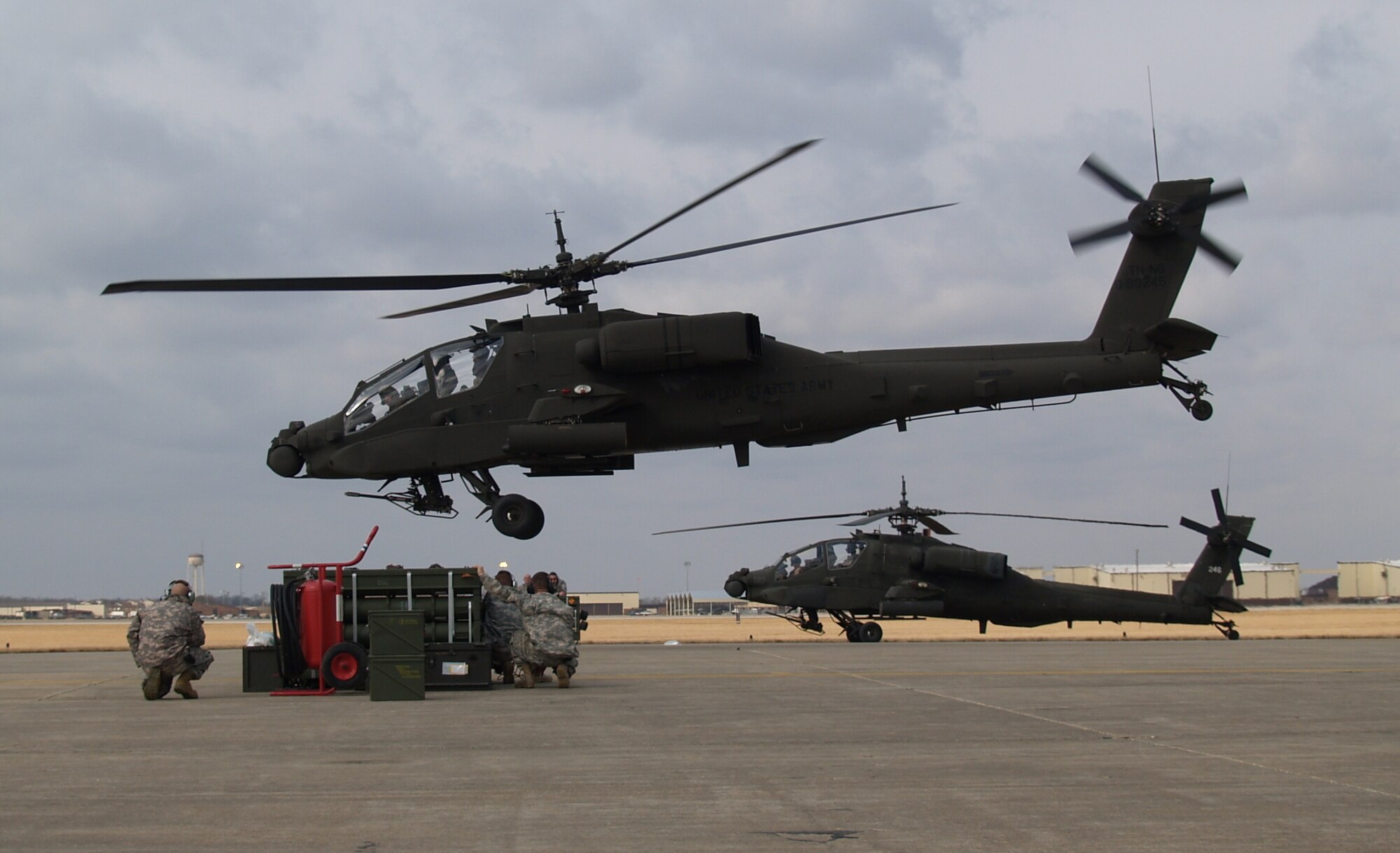 Chief Warrant Officer 2 Thomas Merseal, of Roberstville, and Chief Warrant Officer 2 Gregory Schulte, of Warrensburg, take off after receiving ammunition for the aerial gunnery exercise March. (Photo by Rachel Knight/Missouri National Guard)