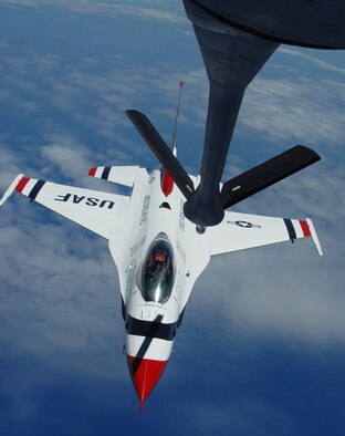 ALTUS AIR FORCE BASE, Okla. -- An Altus KC-135 Stratotanker refuels one of the eight Thunderbirds that participated in an air show held at the new Ceiba Airport, in Ceiba, Puerto Rico, April 18 and 19. Altus’ support in refueling enabled the Thunderbirds to perform at the former U.S. Navy's Roosevelt Roads Naval Base for the first time in 30 years. The Altus KC-135 offloaded 19,746 gallons of fuel to the Thunderbirds.  (U.S.Air Force photo/Senior Airman Jennifer L. Flores)