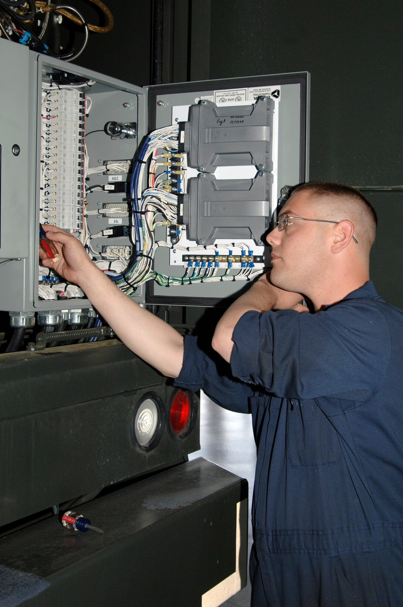 Senior Airman Jacob Thomas adjusts the blower motor speed for the heater on a Global ER-2875 extended reach aircraft deicer at the vehicle maintenance shop here April 29. Vehicle maintainers are currently receiving first-hand training on Charleston AFB's first Global ER-2875 extended reach aircraft deicer. Airman Thomas is assigned to the 437th Logistics Readiness Squadron as a multi-purpose maintenance journeyman. (U.S. Air Force photo/Staff Sgt. Marie Cassetty)(RELEASED)