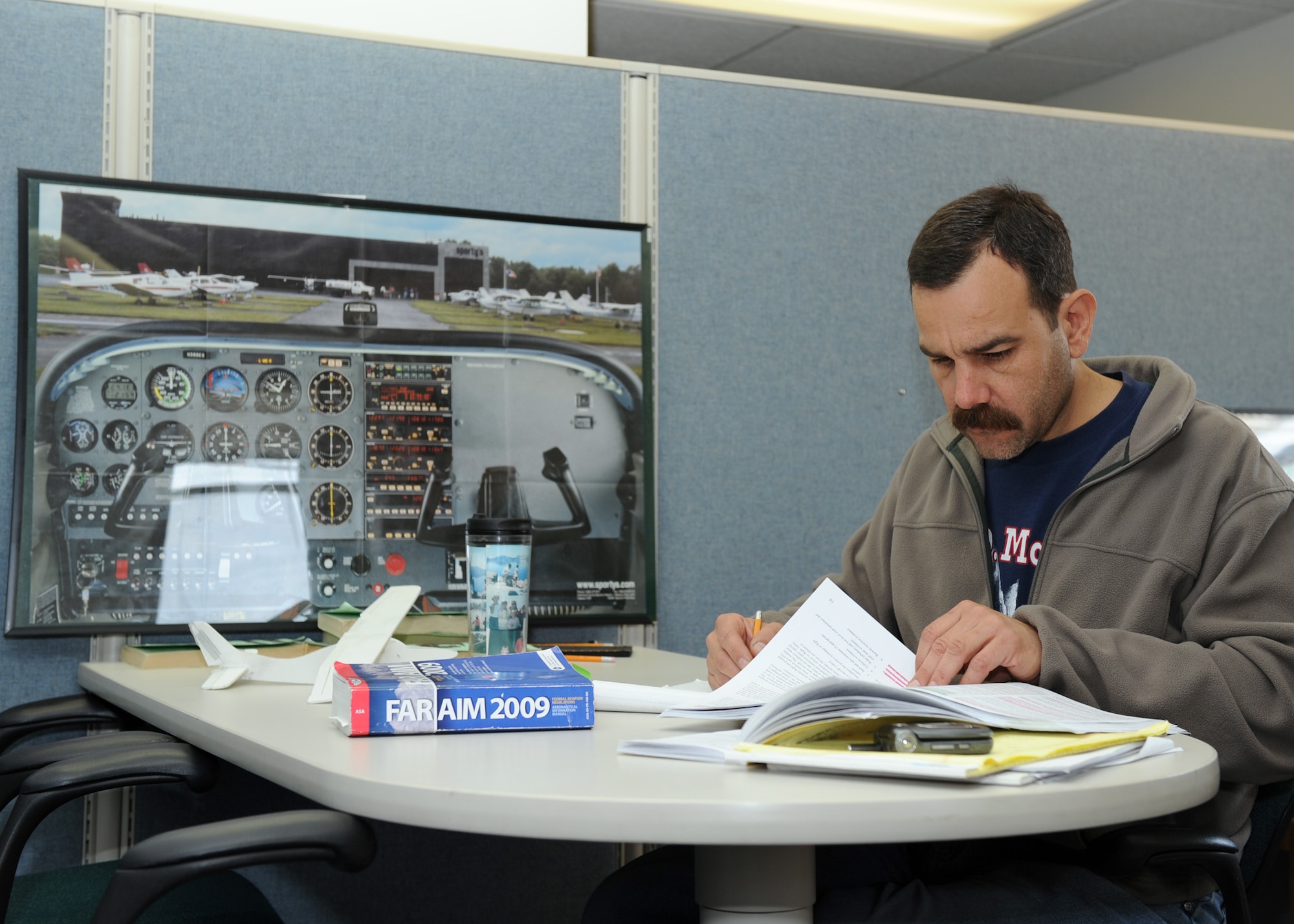 SCOTT AIR FORCE BASE, Ill. --Mr. Tucker, a student at Southwestern Illinois College, and an Aero Club member, studies at the Aero Club for flight instructor certification.(U.S. Air Force photo/Staff Sgt. Paul Villanueva II)