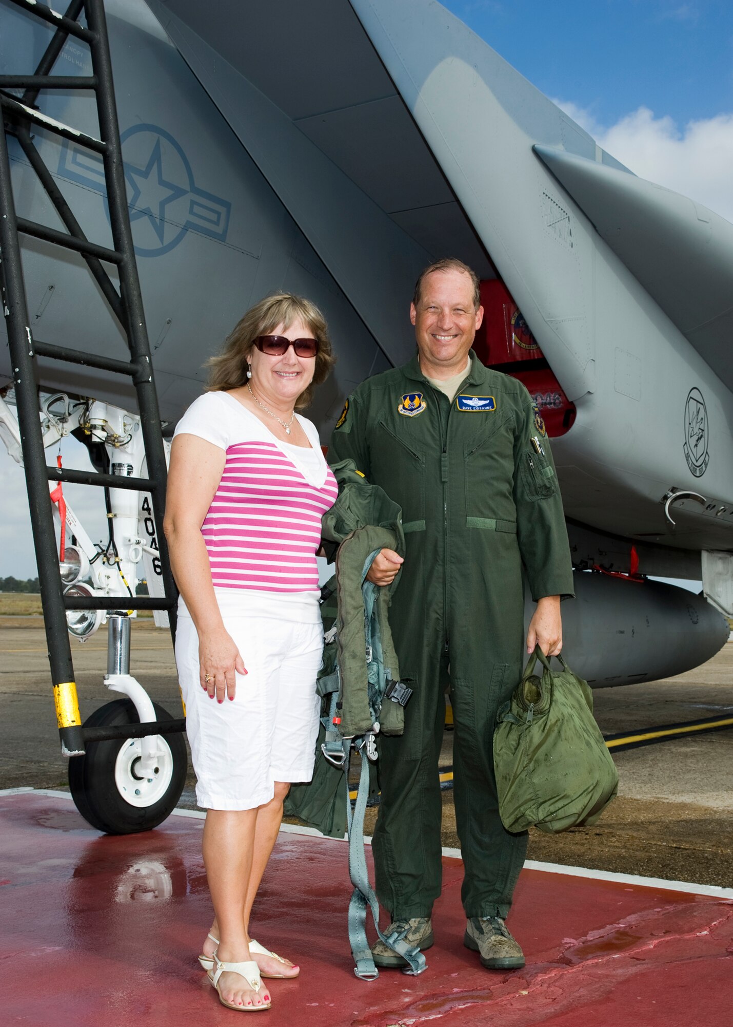 Maj. Gen. David Eidsaune, Air Armament Center commander, stands with his wife Jane, by the F-15 he flew as his final flight as commander, April 27 at Eglin Air Force Base.  Staff members, family and well-wishers watched as he was traditionally hosed down after exiting the aircraft.  General Eidsaune reliquishes command of the AAC May 1, for an assignment at Air Force Materiel Command headquarters.  Courtesy photo.