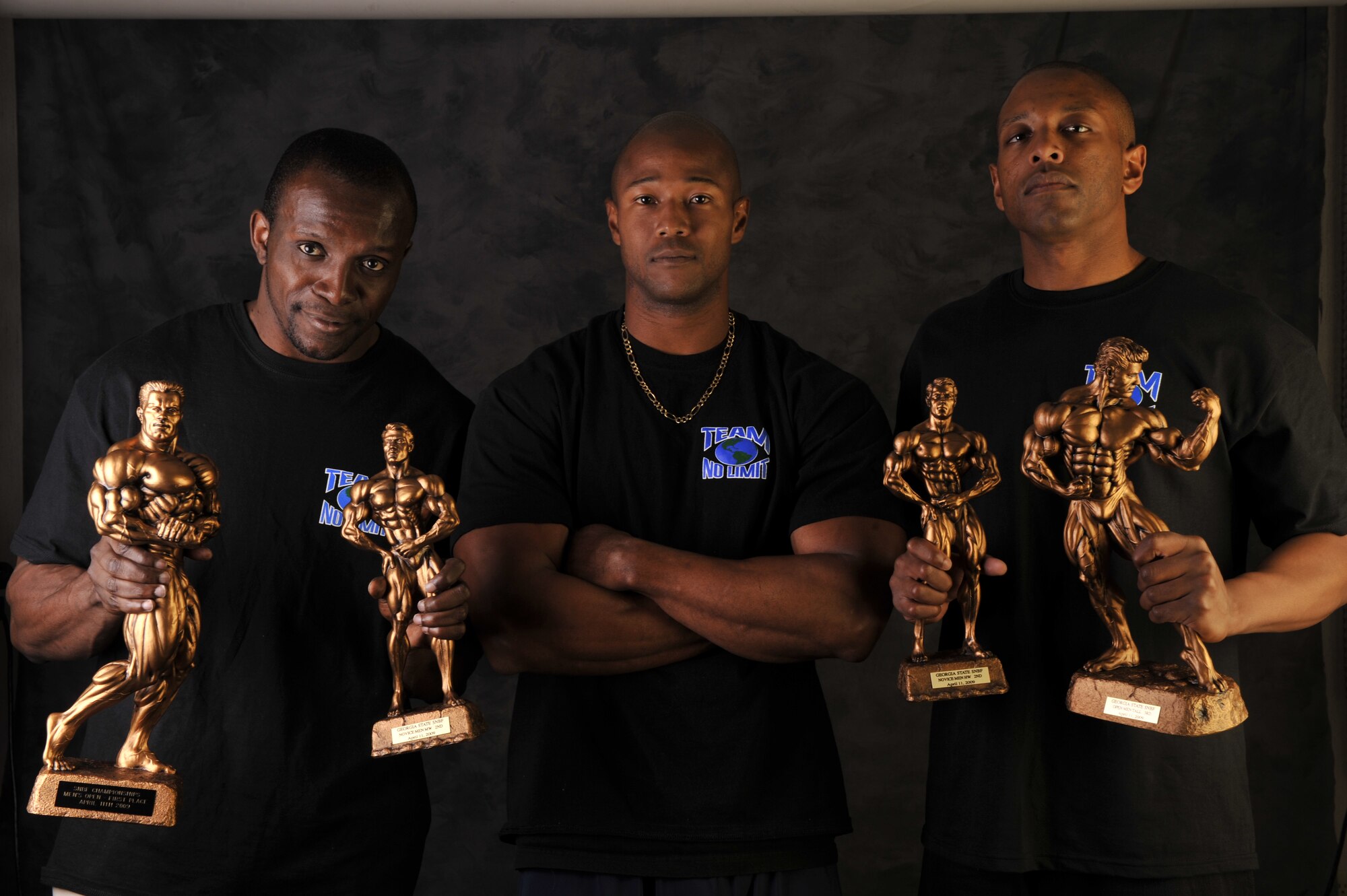MOODY AIR FORCE BASE, Ga. --Gerville Harlequin, Valdosta State University student, Charles Gloster, Freedom I Fitness Center personal trainer, and Senior Airman Rodney Bryant, 824th Security Forces Squadron fire team leader, showcase their achievements here April 16. Mr. Harlequin won first place in the Open Men's Tall and second place in the Novice Men's Middleweight categories. Airman Bryant won second place in the Novice Men's Heavyweight and third place in the Open Men's Tall categories. (U.S. Air Force photo by Senior Airman Schelli Jones)