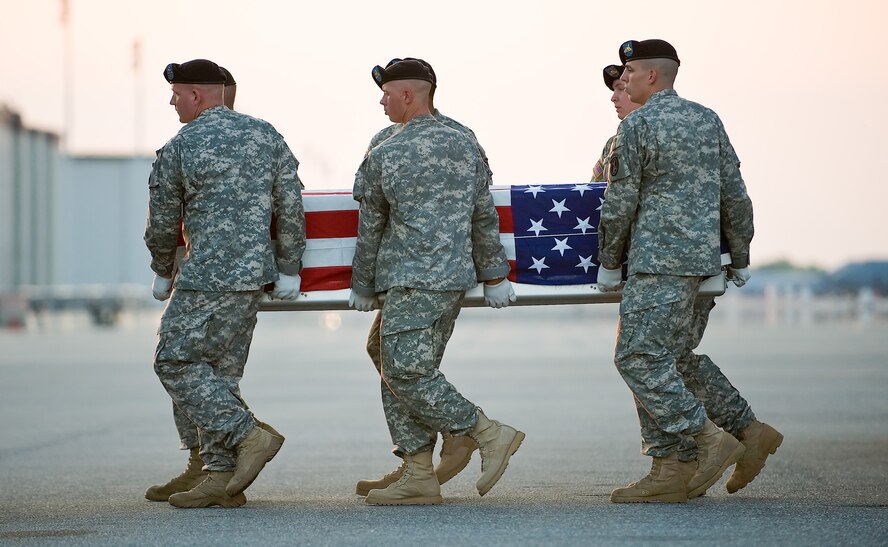 An Army carry team transfers the remains of Army Sgt. Leroy O. Webster, of Sioux City, S. D., at Dover Air Force Base, Del., April 26. Sgt. Webster was assigned to the 3rd Battalion, 82nd Field Artillery, 2nd Brigade Combat Team, Fort Hood, Texas. (US Air Force photo/Roland Balik)