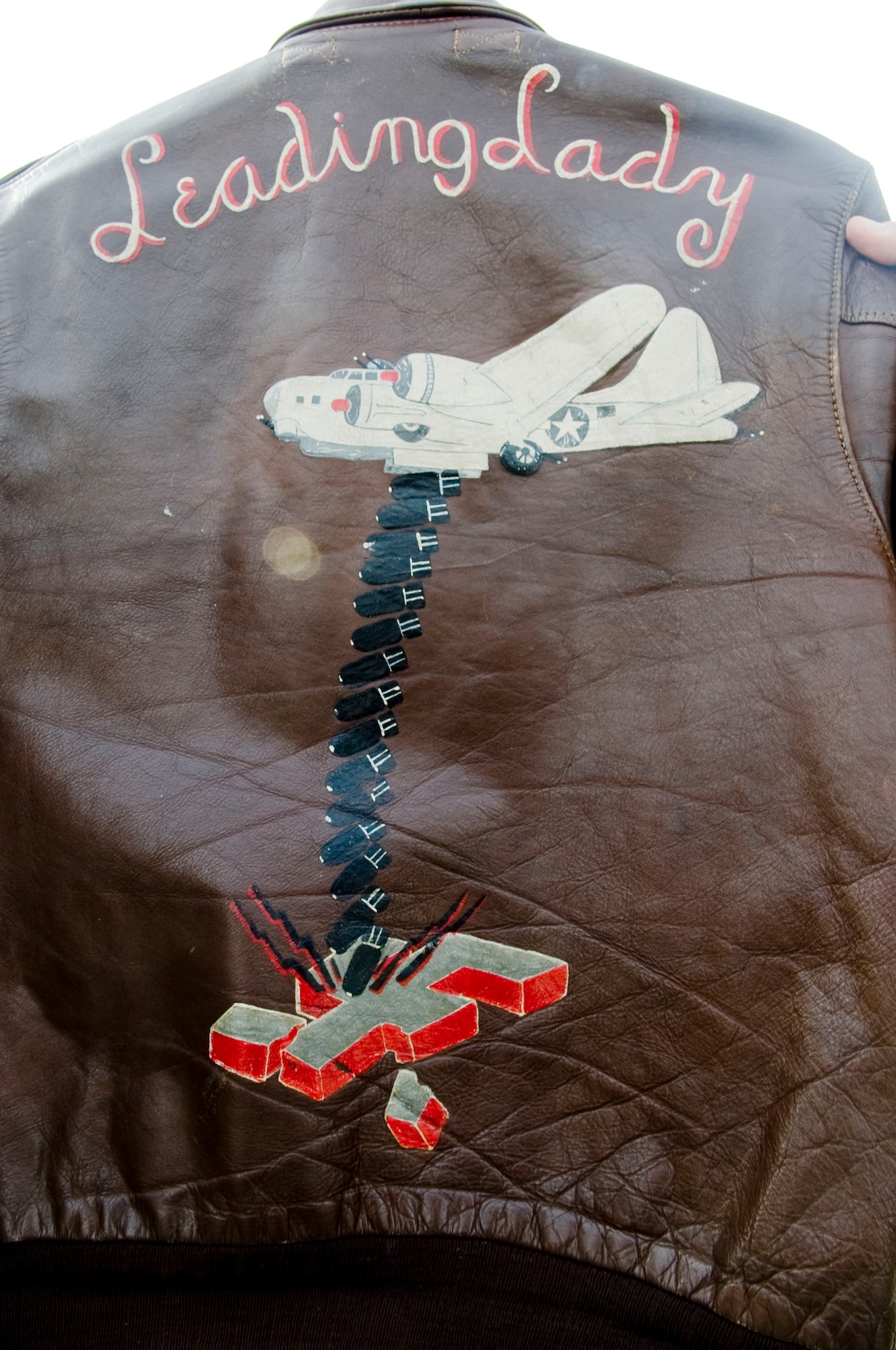 ELMENDORF AIR FORCE BASE, Alaska--Major Jay Moore holds his grandfathers historical WWII Jacket. The jacket was on display for years at a WWII memorial in England.(U.S. Air Force photo by Senior Airman Jonathan Steffen)