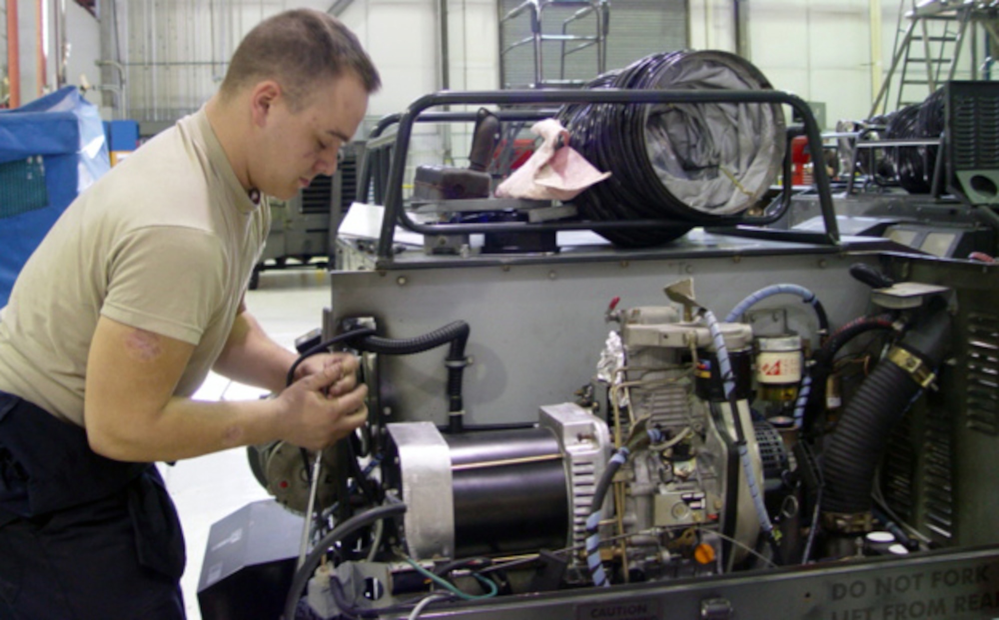Senior Airman Alain Fortin, 436th Maintenance Squadron Aerospace Ground Equipment mechanic, adjusts a New Generation Heater, one of the many pieces of AGE equipment at Dover Air Force Base.  While most units’ sole focus was on the Unit Compliance Inspection, the 436th Maintenance Group and their underlying units were challenged with the UCI in conjunction with the Logistics Standardization and Evaluation Program inspection. (U.S. Air Force photo/Staff Sgt. Christopher Jensen)