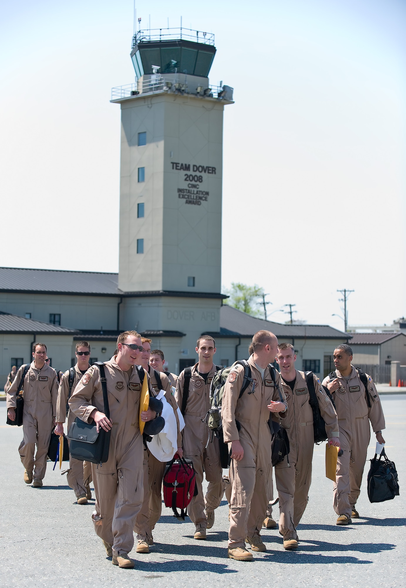 Members of the 3rd Airlift Squadron walk out to the aircraft to depart Dover Air Force Base for Southwest Asia April 26. Approximately 140 members of the squadron deployed from Dover to provide intratheater airlift. (U.S. Air Force photo/Roland Balik)