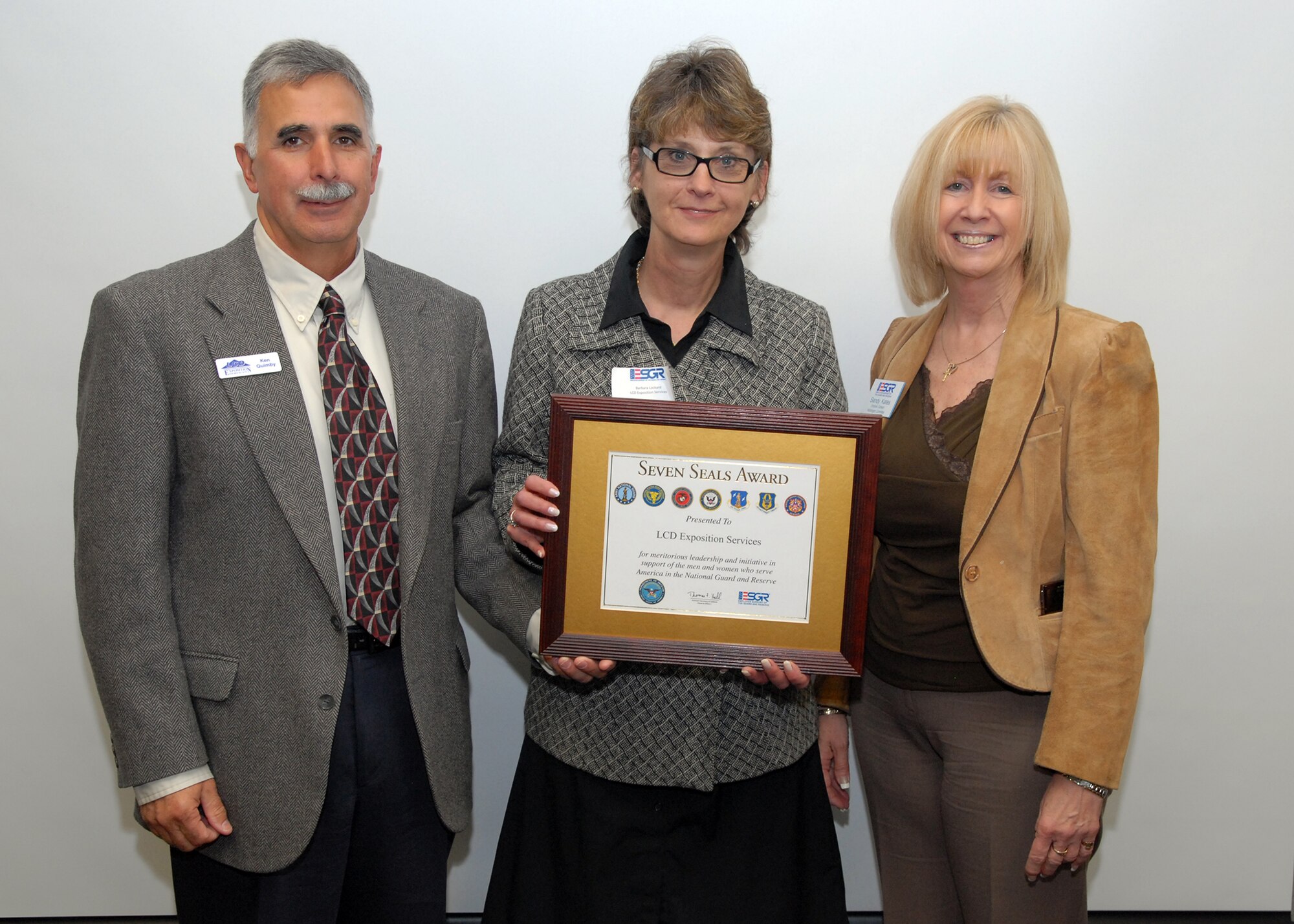 left ken Quimby, LCD Exposition Services President, Barbara Lockard, Vice-President, and Sandy Kates, winner of the Seven Seals Award, were honored at the breakfast.  