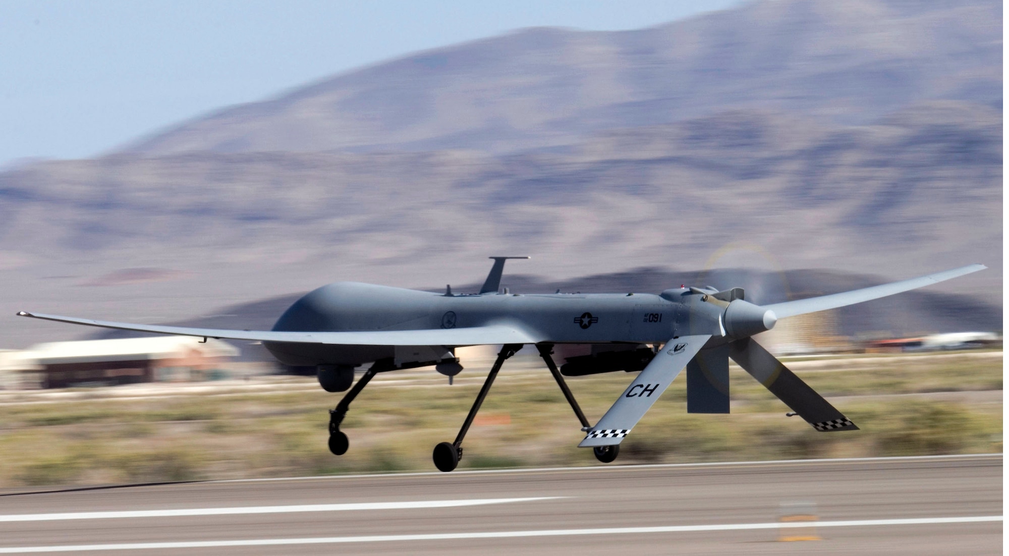 An MQ-1 Predator unmanned aircraft assigned to the 17th Reconnaissance Squadron takes off from Creech Air Force Base, Nev., for a training mission.  (U.S. Air Force photo/Senior Airman Larry E. Reid Jr.) 
