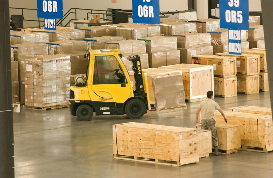 Port Dawgs at the 436th Aerial Port Squadron prepare cargo before it can be loaded onto aircraft bound for overseas locations. More than 17,000 pounds of total cargo moved through the Super Port during the month of March. (U.S. Air Force photo/Jason Minto)