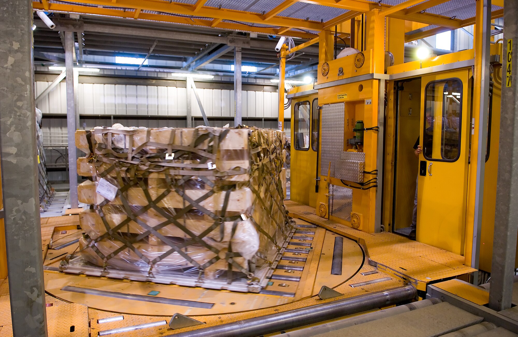 The Mechanized Material Handling System scans a pallet before placing the pallet into storage.  The MMHS performs a 3-dimensional scan of each pallet as part of the system for storing and locating pallets. (U.S. Air Force photo/Jason Minto)
