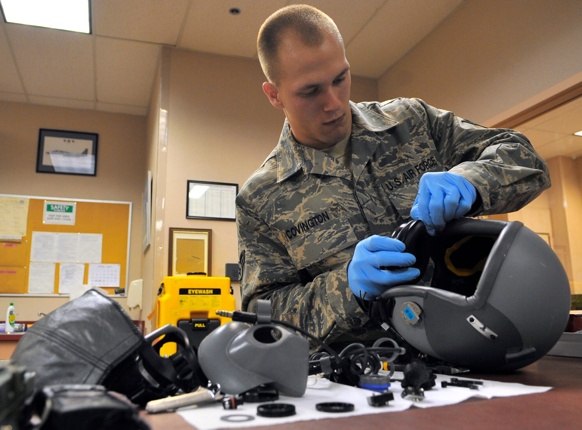 Airman 1st Class Carl Covington disassembles an oxygen mask and helmet for inspection during Red Flag-Alaska April 23 at Eielson Air Force Base, Alaska. Red Flag-Alaska is a Pacific Air Forces-directed field training exercise for U.S. and coalition forces flown under simulated air-combat conditions. Airman Covington is an aircrew flight equipment journeyman assigned to the 35th Operations Support Squadron from Misawa Air Base, Japan. (U.S. Air Force photo/Senior Airman Christopher Boitz) 
