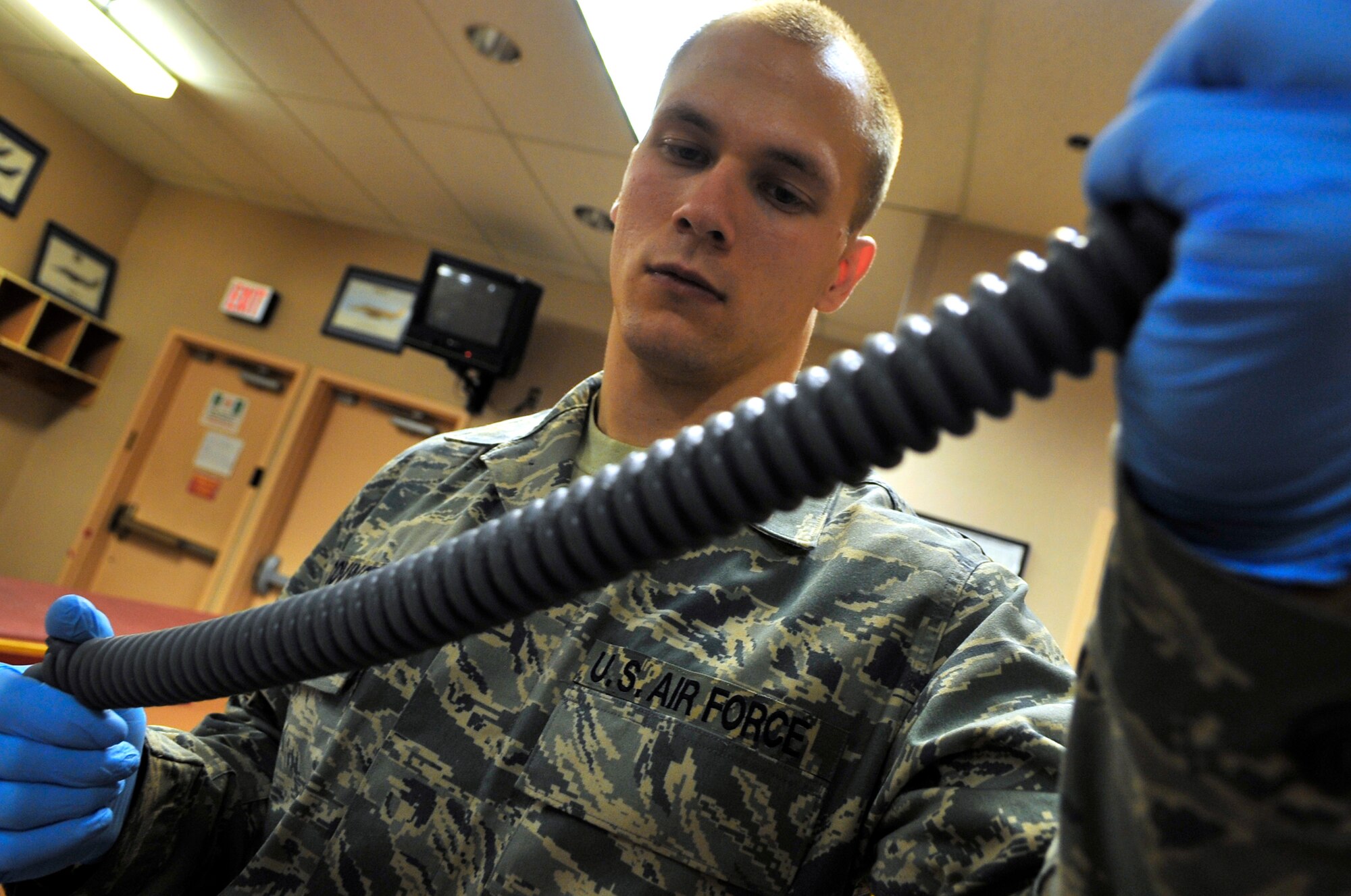 Airman 1st Class Carl Covington inspects for gouges or leaks on an oxygen hose during Red Flag-Alaska April 23 at Eielson Air Force Base, Alaska. Red Flag-Alaska is a Pacific Air Forces-directed field training exercise for U.S. and coalition forces flown under simulated air-combat conditions. Airman Covington is an aircrew flight equipment journeyman assigned to the 35th Operations Support Squadron from Misawa Air Base, Japan. (U.S. Air Force photo/Senior Airman Christopher Boitz) 
