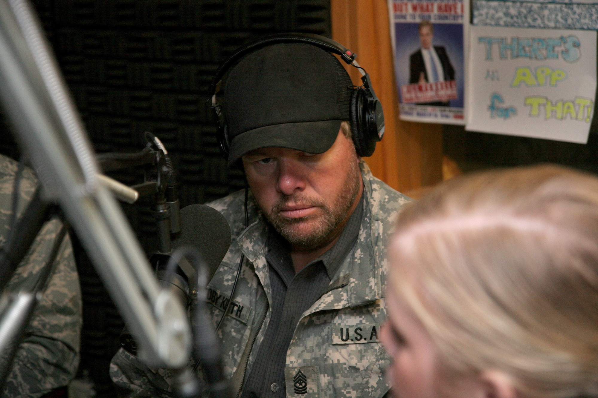 Country music superstar Toby Keith is interviewed by Senior Airman Caitlin Jones on American Forces Network Aviano's ZFM 106 morning show at Aviano Air Base, Italy April 29.  Mr. Keith just returned from Afghanistan where he was entertaining the troops on his USO sponsored "America's Toughest Tour 2009".  He stopped by Aviano before continuing the tour with a concert at Camp Darby, Italy, April 29 and U.S. Army Garrison Vicenza, Italy April 30.  (U.S. Air Force photo/Senior Master Sgt. Robert W. Valenca) 