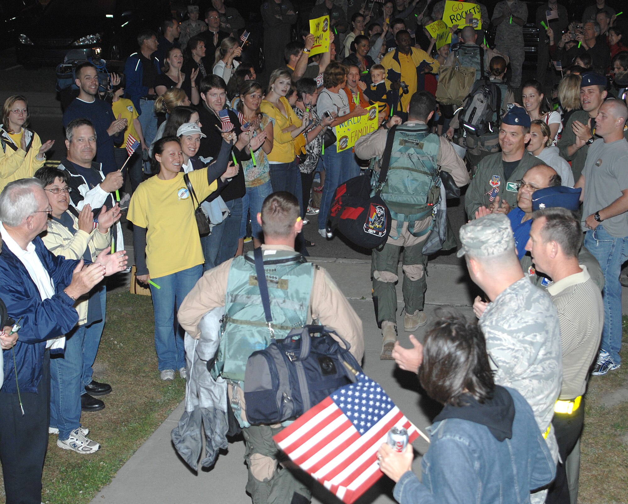 Members of the 336th Fighter Squadron are greeted by a throng of supporters at Seymour Johnson Air Force Base, N.C., April 29, 2009.  Friends, families and members of the Military Affairs Committee cheered on the Rockets as they made their way to the flightline for departure.  (U.S. Air Force photo by 2nd Lt. Matthew D. Schroff)