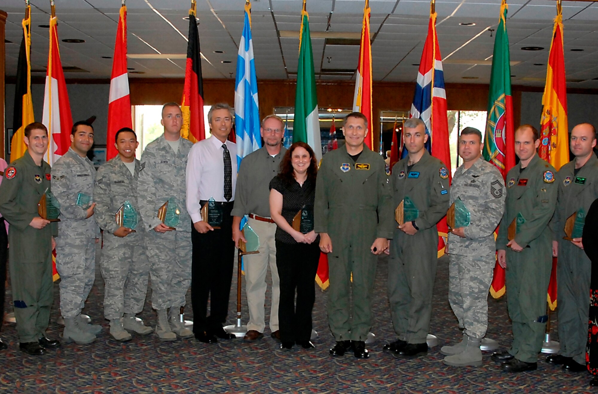 The 80th Flying Training Wing recognizes their Quarterly Award winners. From left to right, Capt. David Mitchell, 89th Flying Training Squadron, Airman 1st Class Carlos Morales, 80th Operation Support Squadron, Senior Airman Domer Gabriel, 89th FTS, Staff Sgt. Jason Bower, 80th OSS, David Bowles, 80th OSS, Klaus Lammers, 80th OSS, Amber Shipe, 80th OSS, Col. Daniel Torweihe, 80th FTW vice commander, Maj. Richard Altobello, 80th OSS, Senior Master Sgt. Ricardo Young, 80th OSS, Maj. Matt Sallee, 88th FTS, and Capt. Benjamin Jensen, 89th FTS. (U.S. Air Force photo/Mike Litteken)