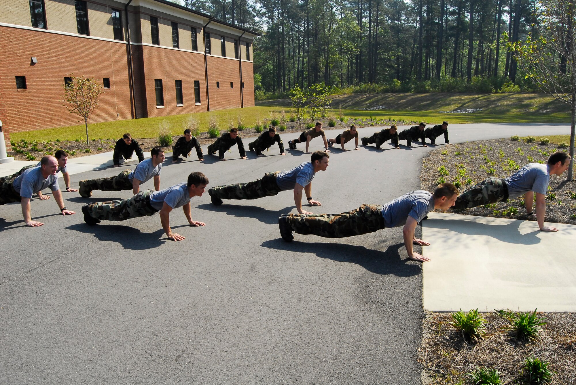 Trainees and instructors at the Combat Control School at Pope Air Force Base, N.C. perform "memorials" April 24. "Memorials" is a PT session recognizing the sacrifice of the 52 Combat Controllers who were killed in action. (U.S Air Force Photo by Tech. Sgt. Todd Wivell)