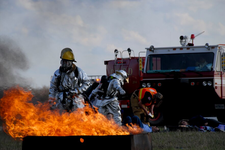 Members of the 180th Fighter Wing fire department participated in an aircraft crash and recovery exercise at the Toledo Express Airport on April 22. The drill, required every three years, not only tests the response of airport authorities, but also the response of other local emergency, fire and rescue crews that would normally respond to such an incident, to include the 180th FW fire department. USAF photo by Tech. Sgt. Beth Holliker (Released)