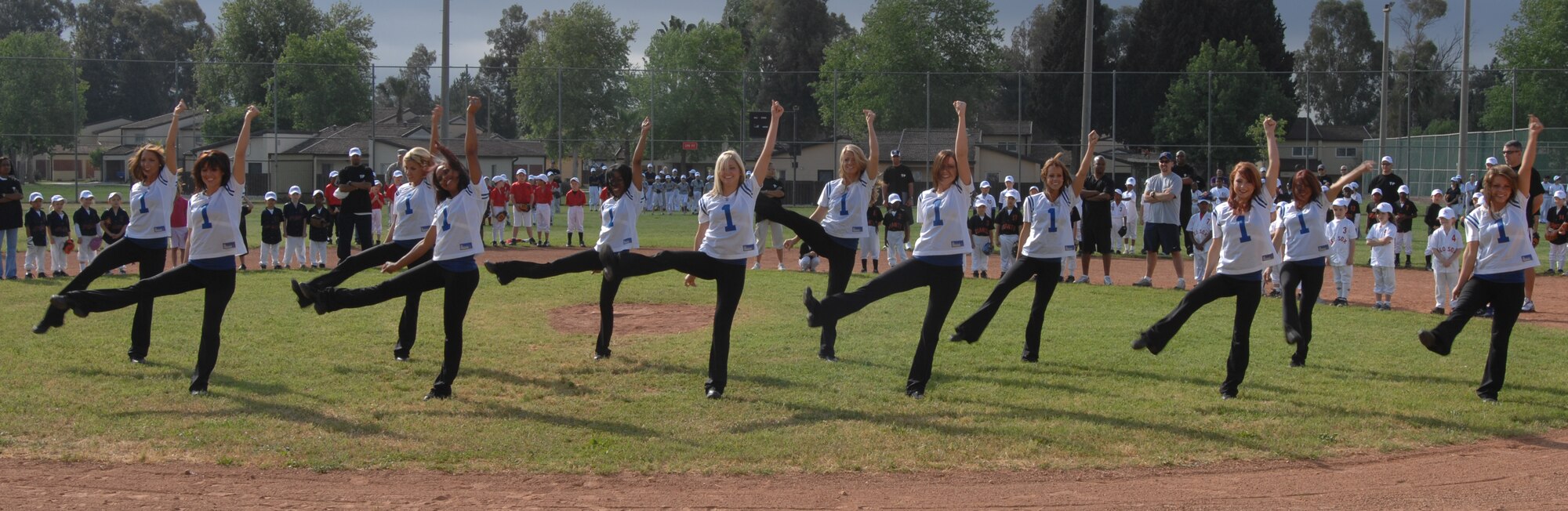 The Indianapolis Colts Cheerleaders perform at the Little League opening day ceremony at Incirlik Air Base, Turkey, Saturday, April 25, 2009. The cheerleaders visited the base as part of the Armed Forces Entertainment tour and taught a cheer camp at the youth center as well as put on a variety show for the base populace. (U.S. Air Force photo/Staff Sgt. Lauren Padden)