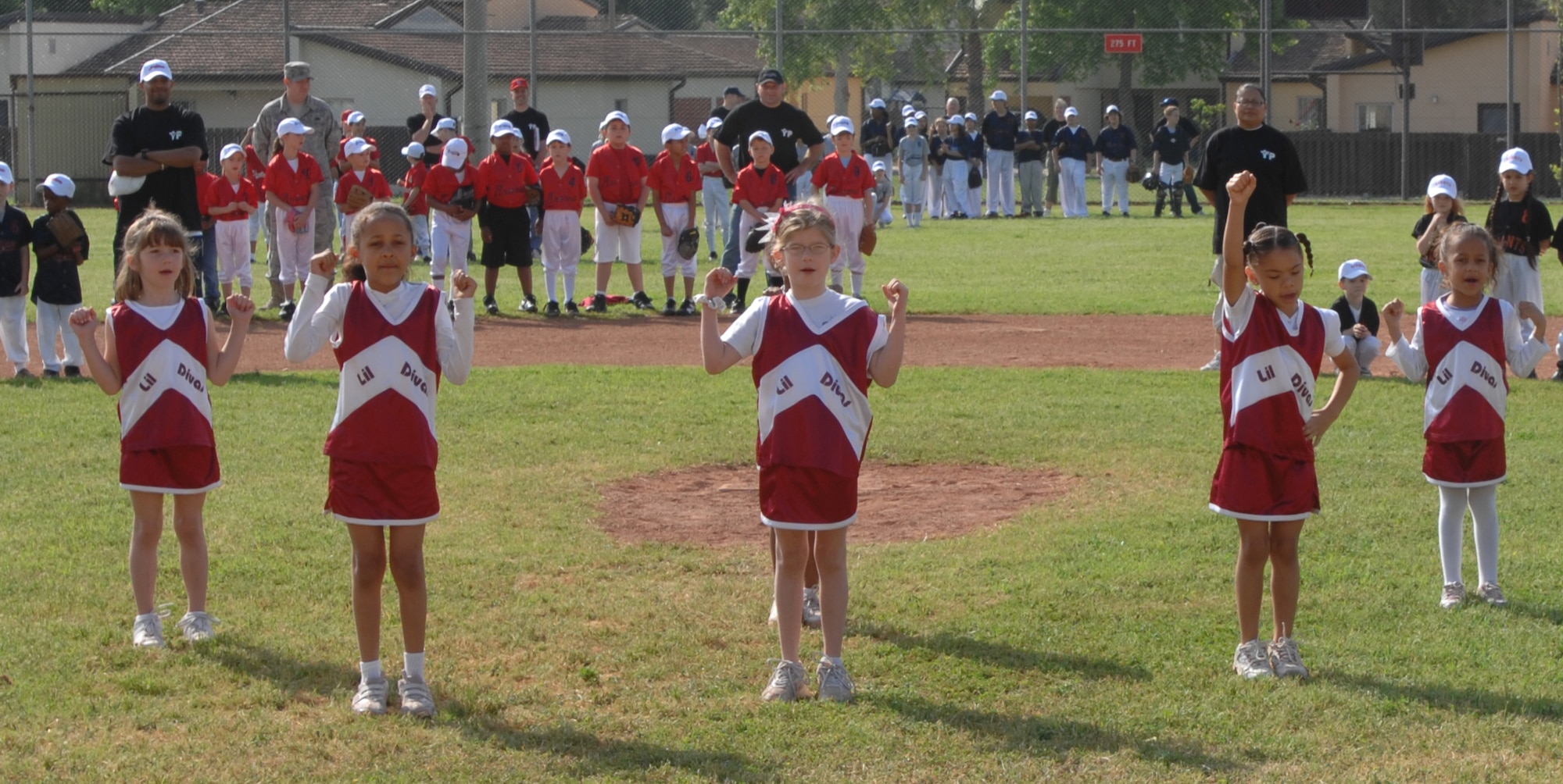 The Lil Divas cheerleaders perform a cheer at the Little League opening day ceremony at Incirlik Air Base, Turkey, Saturday, April 25, 2009. The cheerleaders are a group in the Youth Program and range in ages from 5-8 years old. (U.S. Air Force photo/Staff Sgt. Lauren Padden)