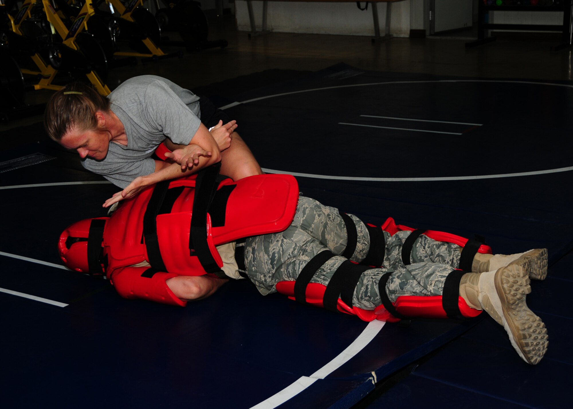 SOUTHWEST ASIA -- Army Capt. Elizabeth Williams, 218th Medical Detachment veterinarian, takes down a simulated assailant during Sexual Assault Self-Defense training at an air base in Southwest Asia, April 26. During the training the students learned how to used different self-defense techniques safely. Captain Williams is currently deployed from Fort Lewis, Wash., and is originally from Live Oak, Fla. (U.S. Air Force photo/ Senior Airman Courtney Richardson)