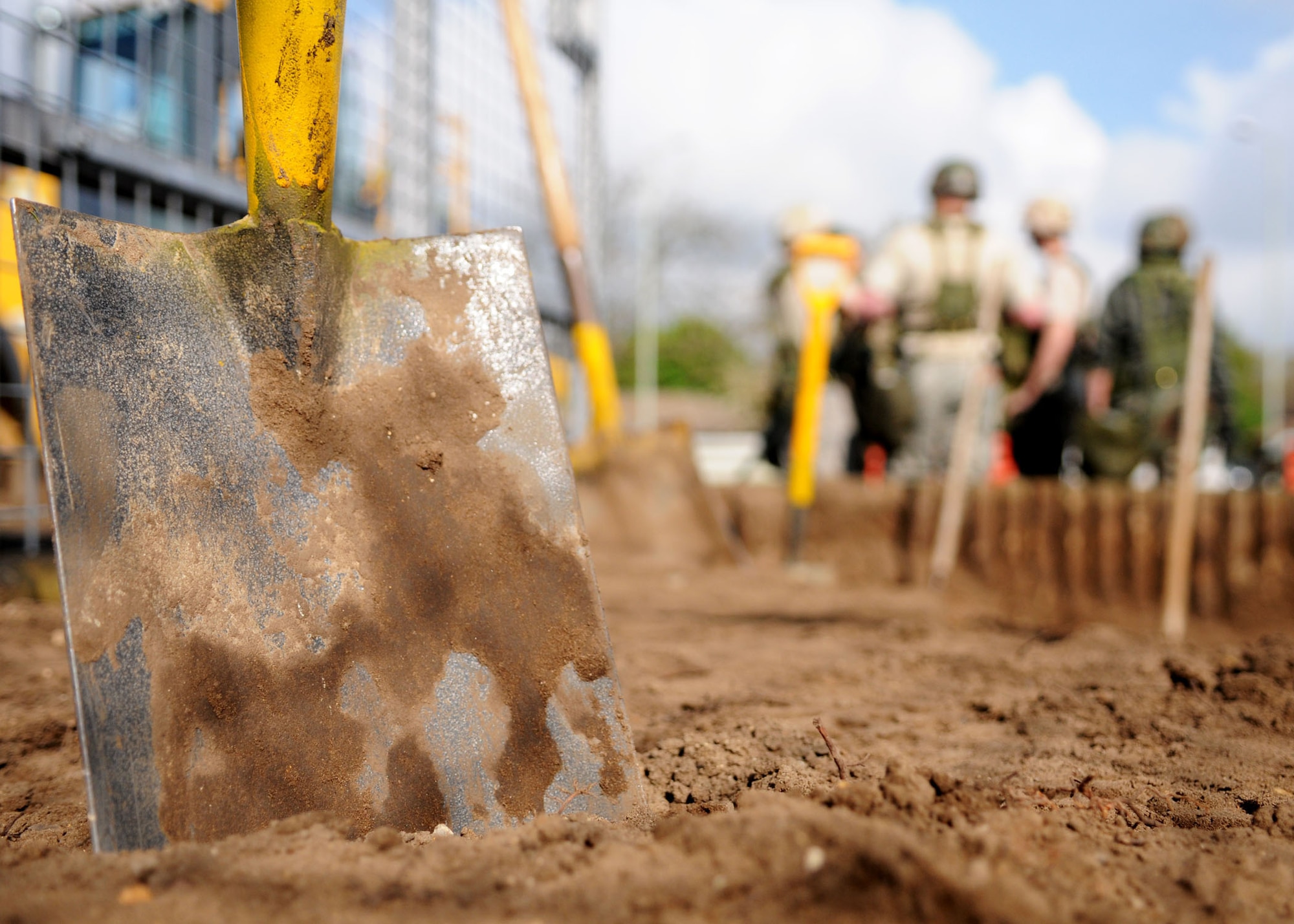 A shovel sits while Airmen from the 100th Civil Engineer Squadron take a break, during the deconstruction of planter boxes at the roundabout near billeting April 28, 2009, at RAF Mildenhall, England. Normally engineering projects are contracted out to civilian companies, but for the first time RAF Mildenhall Airmen were solely responsible of the entire engineering project. The purpose was to remove the plants and planter boxes so the area can be repaved to make it more appealing. (U.S. Air Force photo by Staff Sgt. Jerry Fleshman)