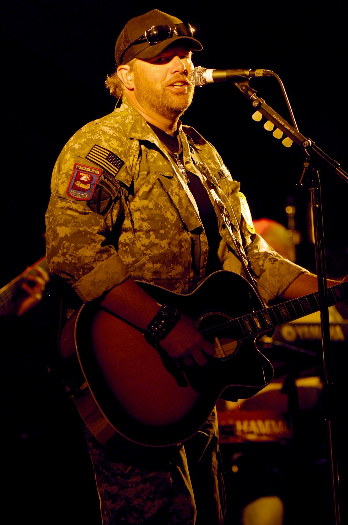Country music singer, Toby Keith, performs for more than 1,000 service members during his United Service Organizations tour at Bagram Air Field, Afghanistan April 27.  The USO is a world-wide organization that seeks to contribute to the morale and personal welfare of U.S. military personnel and their families. The USO helps channel the American public's desire to give back to those who serve the U.S. into programs and services that enrich their lives. (U.S. Air Force photo/Senior Airman Steven R. Doty)(Released)