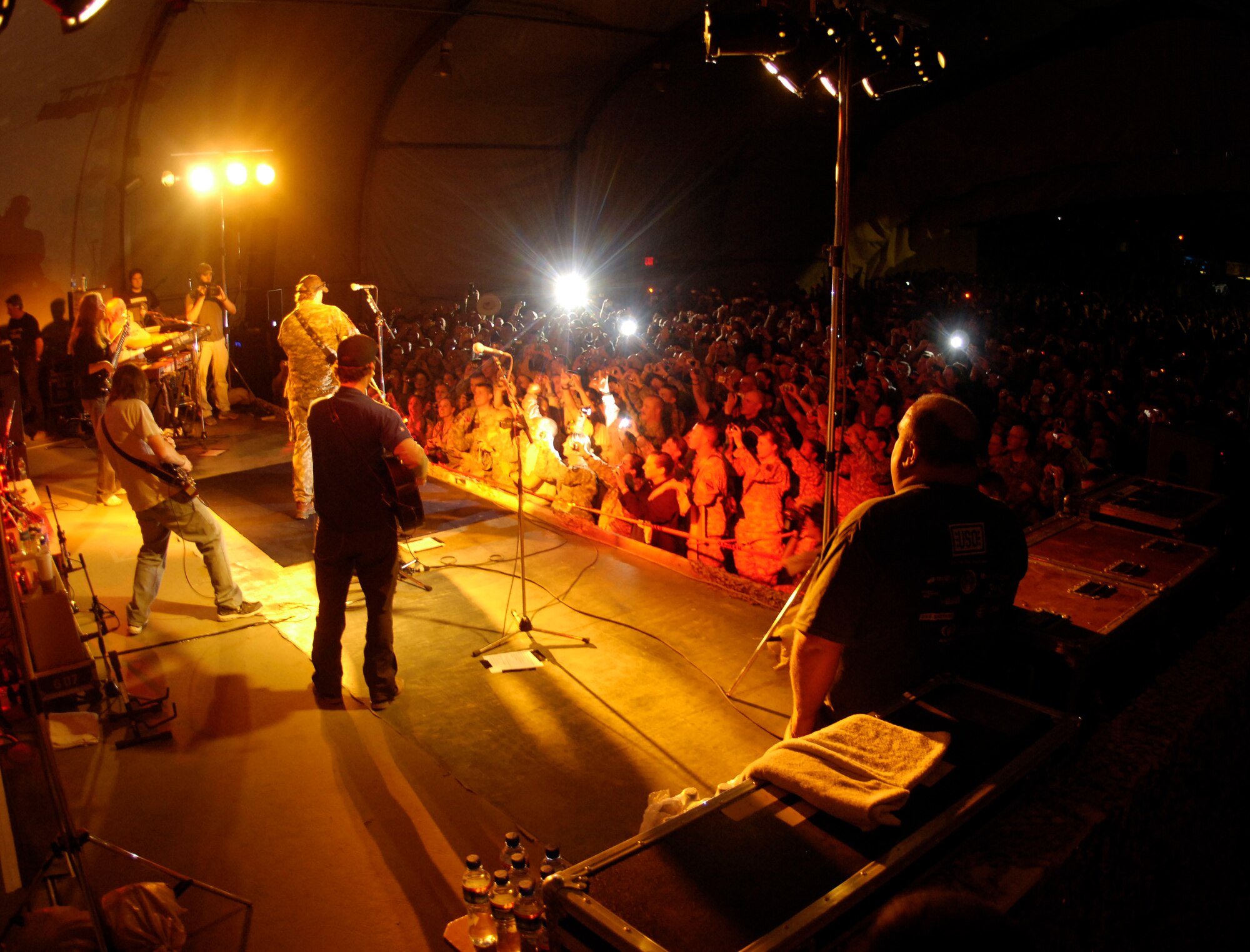 Country music singer, Toby Keith, makes his appearance to more than 1,000 service members during his United Service Organizations tour at Bagram Air Field, Afghanistan April 27.  The USO was founded in Times Square, New York in 1941 in response to a request from President Franklin D. Roosevelt to provide morale and recreation services to uniformed military personnel. Today, the USO today is alive and well, observing 65 years of serving our men and women in uniform and their families around the world. (U.S. Air Force photo/Senior Airman Steven R. Doty)(Released)