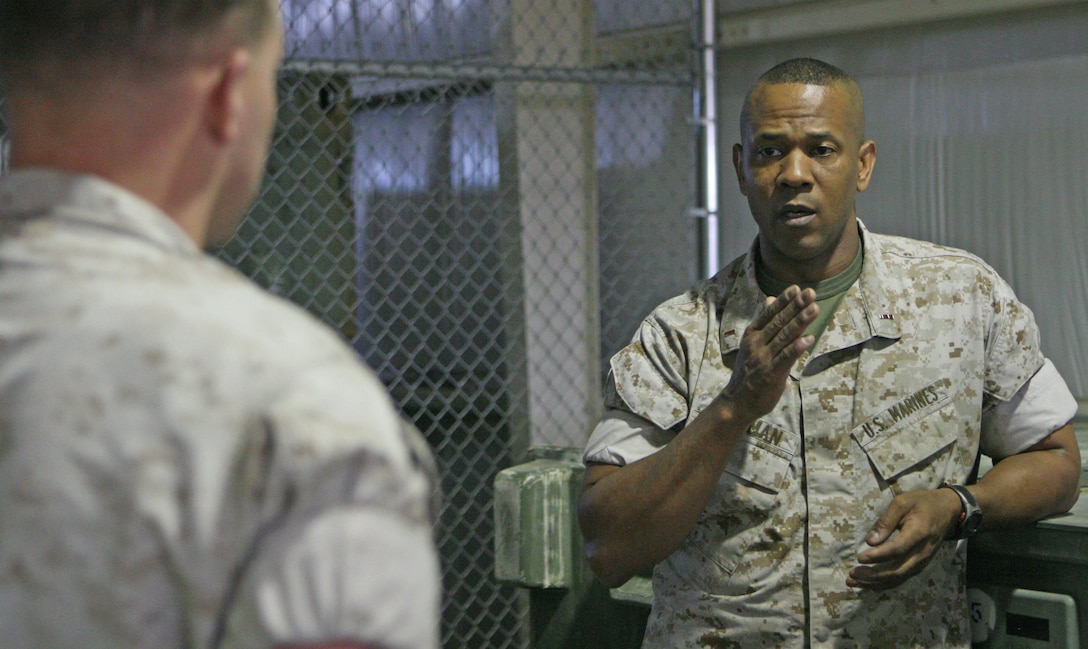 Marine Corps Chief Warrant Office 4 Rodney Freeman, a 40-year-old Clarks Hill, S.C., native, and chemical, biological, radiological, nuclear defense officer with 2nd Assault Amphibian Battalion, 2nd Marine Division, talks to Lance Cpl. Robert Forsyth, a CBRN Marine, about the importance of having good leadership skills. U.S. Marine Corps photo by Cpl. Casey Jones