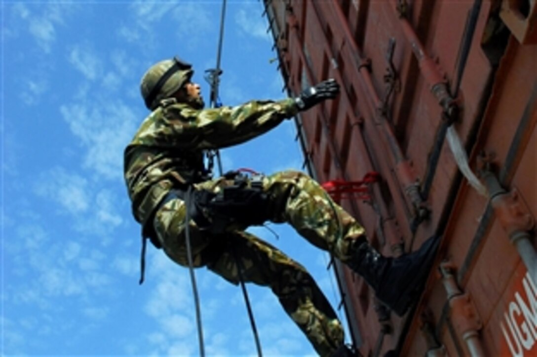 An Italian Marine participates in a cargo container inspection exercise during exercise Phoenix Express 2009, Souda Bay, Greece, April 28, 2009. Phoenix Express is part of the overall U.S. Africa Command and U.S. Naval Forces Europe, U.S. Naval Forces Africa and U.S. 6th Fleet's  theater security cooperation strategy to enhance regional stability in the region through increased interoperability and cooperation among regional allies from the United States, Africa, and Europe.