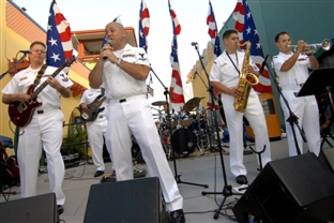 Members of the Navy Region Southeast's rock band Pride entertain more than 1,000 U.S. Marines and sailors, Coast Guard members and Canadian Navy personnel at the Seminole Hard Rock Hotel and Cafe in Hollywood, Calif., April 27, 2009. From left, Petty Officer 2nd Class Chris Morrison; Petty Officer 3rd Class Sean Meyer; Petty Officer 3rd Class Chris Castro, on drums; Petty Officer 1st Class Louis Lebron; Petty Officer 3rd Class Jorge Argueta and Petty Officer 3rd Class Gene Register.