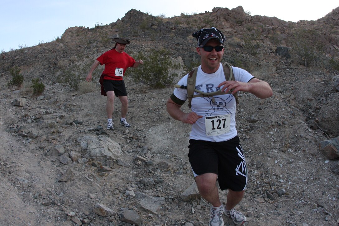 A runner during the 23rd annual ridge run makes his way down one of the dangerous hills located behind the Combat Center’s main side April 30.