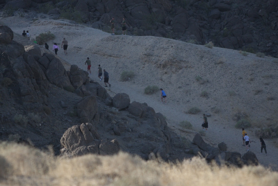The runners make their way up one of the large hills behind the Combat Center’s main side during the 23rd annual ridge run April 30.