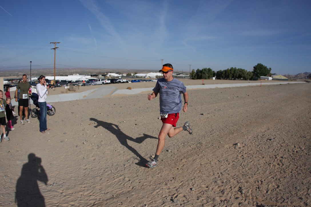 A runner sprints to the finish during the Robert E. Bush Naval Hospital sponsored Ridge Run Race April 30.