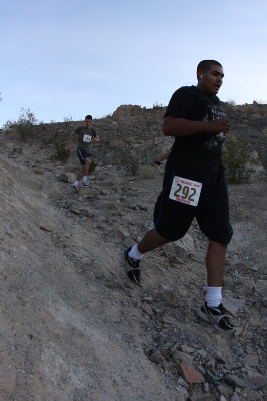 A runner during the 23rd annual ridge run makes his way down one of the dangerous hills located behind the Combat Center’s main side April 30.
