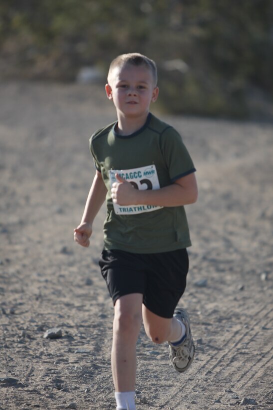 Clayton Davis, an eight year old son of a Marine, sprints towards the finish of the five kilometer (3.11 mile) race during the 23rd annual ridge run April 30. Davis finished first in his age group, 25 and under.