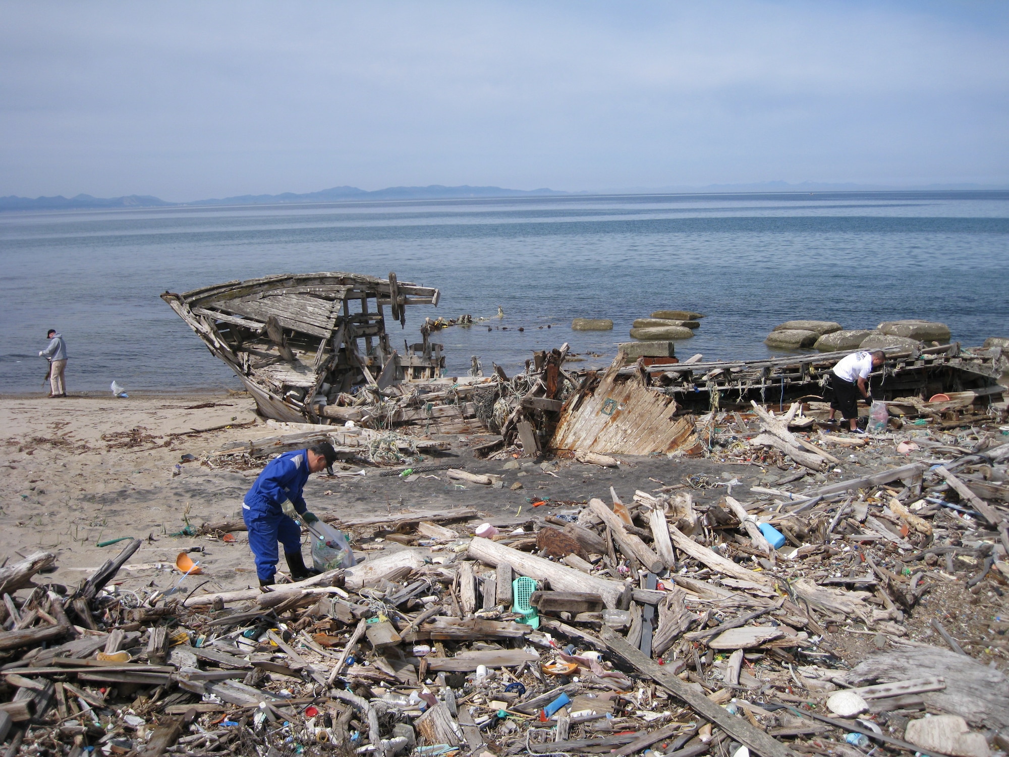 NOHEJI, Japan – Americans and Japanese pick up trash at Momoishi Beach April 18, 2009. The clean up of Momoishi Beach, also know as Ship Wreck Beach, was organized by the 35th Civil Engineering Squadron’s First Four Association. (Courtesy photo)