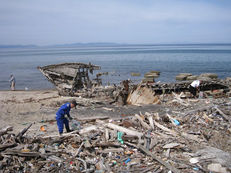 NOHEJI, Japan – Americans and Japanese pick up trash at Momoishi Beach April 18, 2009. The clean up of Momoishi Beach, also know as Ship Wreck Beach, was organized by the 35th Civil Engineering Squadron’s First Four Association. (Courtesy photo)
