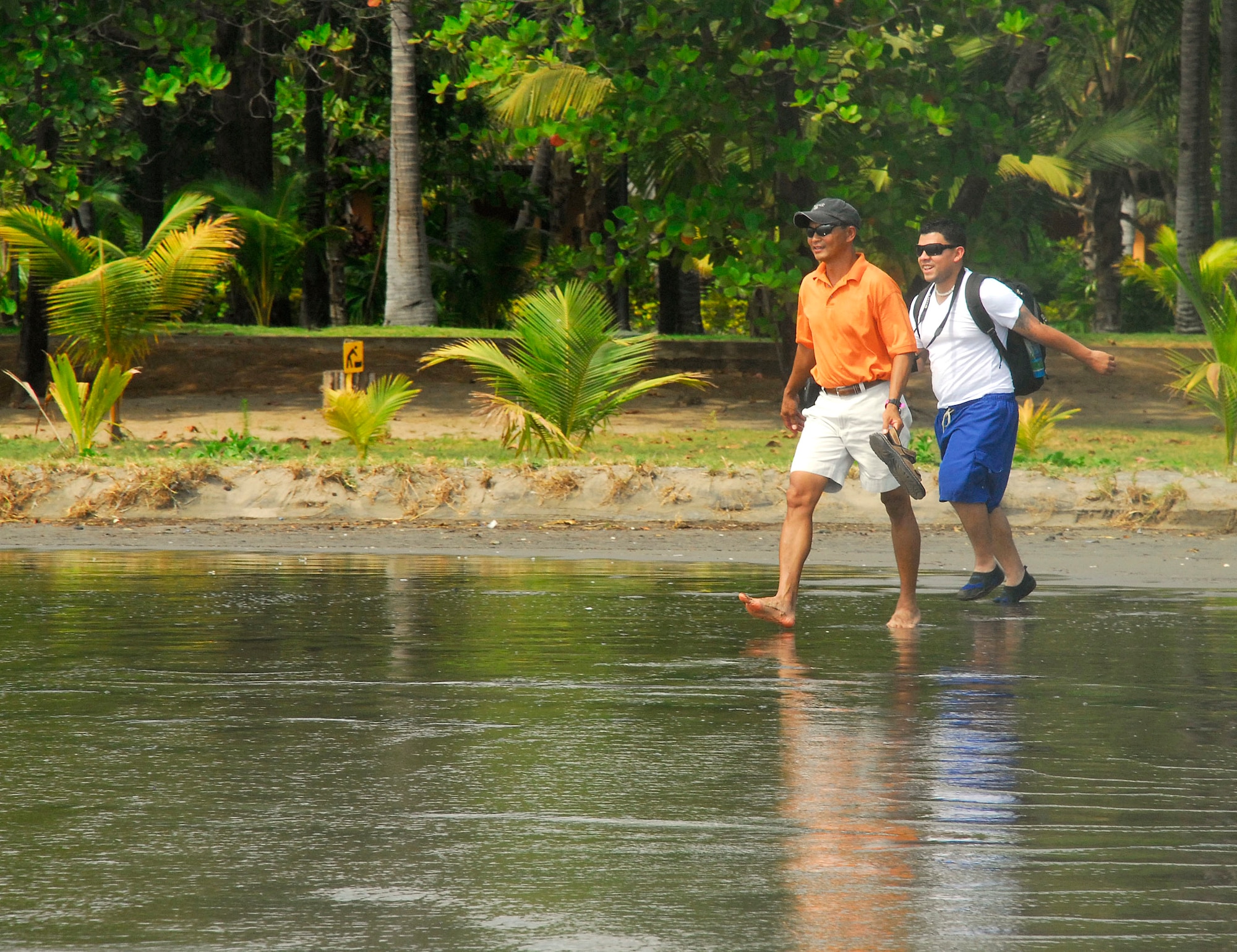 U.S. Army Sergeant First Class Ernest Ocariza and Sergeant Oscar Castaneda walk along the beach near Montelimar, Nicaragua, during the Warrior Health and Healing retreat there April 25. Thirty-seven recently-returned OPERATION IRAQI FREEDOM and OPERATION ENDURING FREEDOM veterans attended the retreat to share experiences and attend classes on reintegration topics. (U.S. Air Force photo/Tech. Sgt. Mike Hammond)